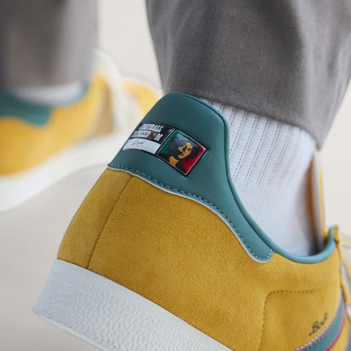 Gazelle Jamaica x Bob Marley Mens Lifestyle Shoes (Bold Gold/None/Pure Ruby)