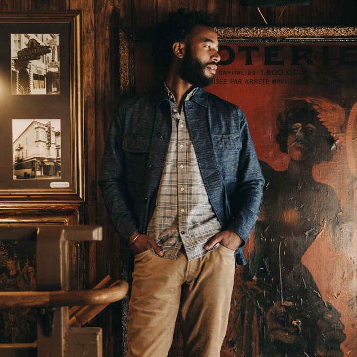 fit model wearing The BDU Shirt Jacket in Indigo Slub, hand in pockets indoors