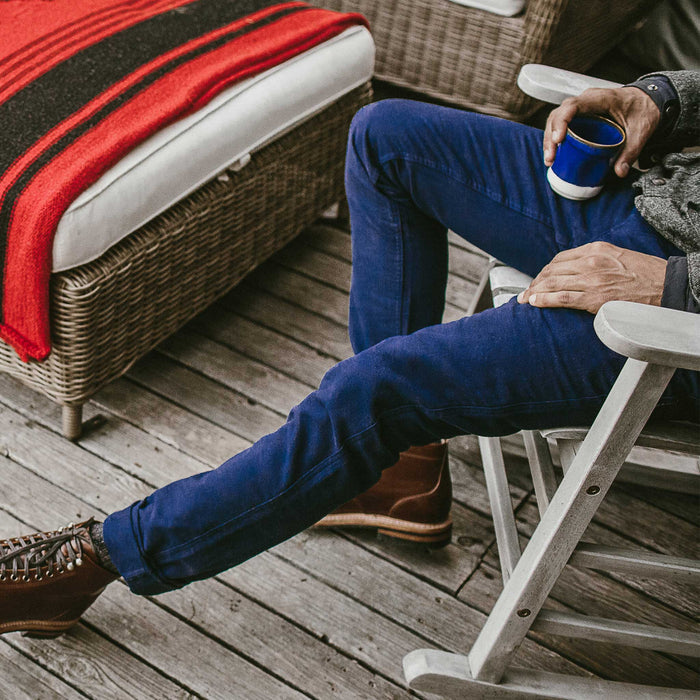 A side shot of the fit model wearing the moleskin pants lounging
