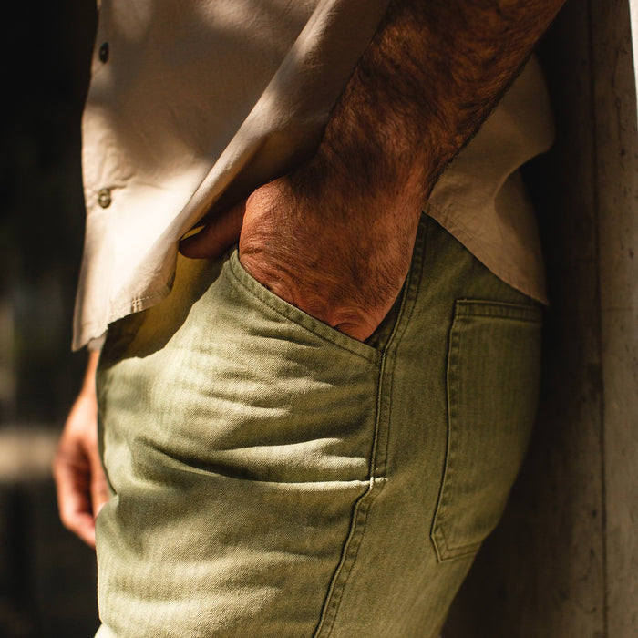 fit model wearing The Camp Pant in Olive Herringbone, hand in pocket