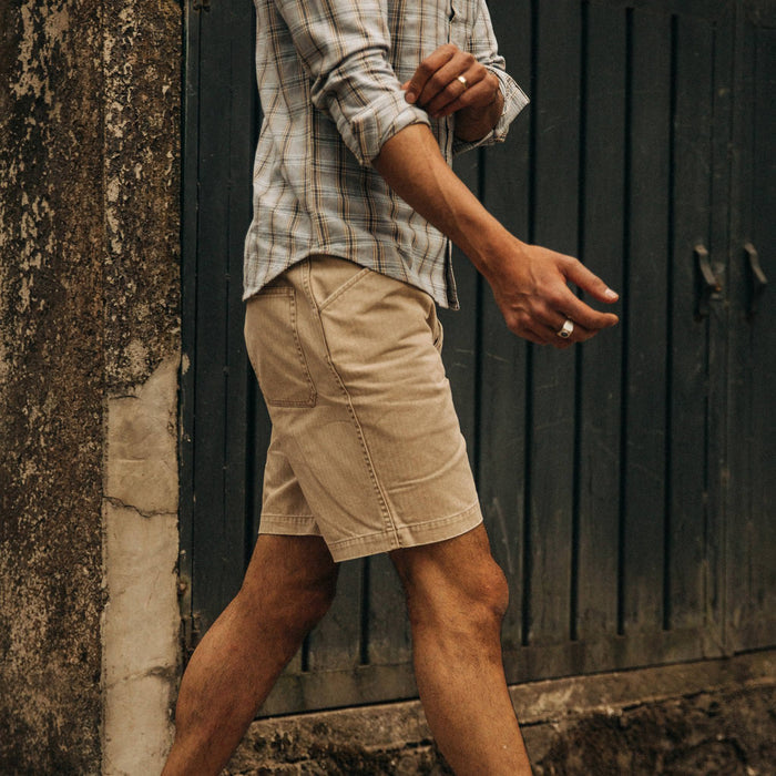 fit model wearing The Camp Short in Khaki Herringbone, walking right of camera