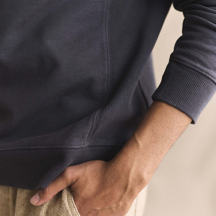 fit model showing the ribbed cuffs and hem on The Cotton Hemp Crew in Asphalt