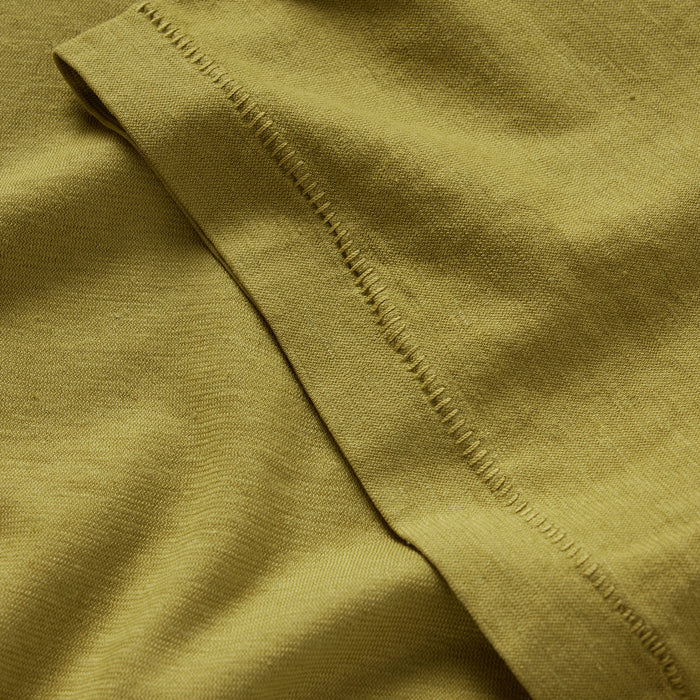 material shot of the sleeve on The Cotton Hemp Tee in Juniper