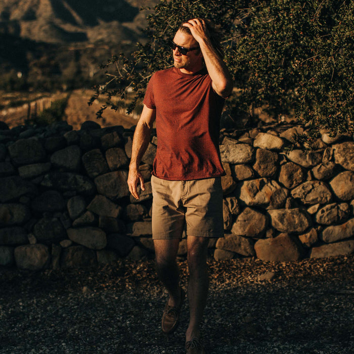 fit model walking in The Cotton Hemp Tee in Rust and Navy Stripe