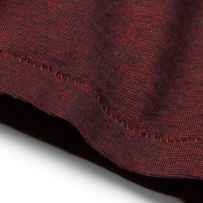 material shot of the hem on The Cotton Hemp Tee in Rust and Navy Stripe