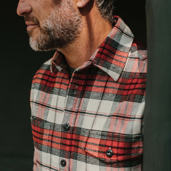 fit model wearing The Crater Shirt in Engine Plaid leaning against a pole