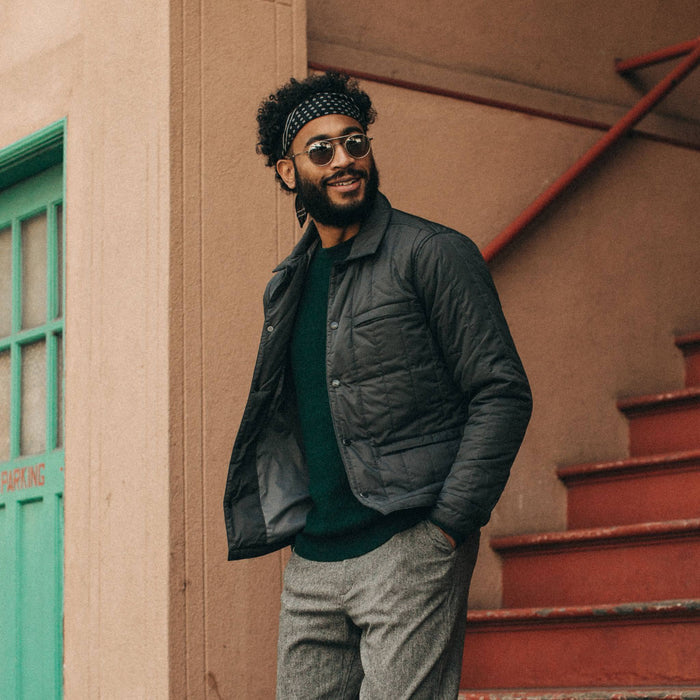 fit model wearing The Decker Jacket in Charcoal Quilt, looking right