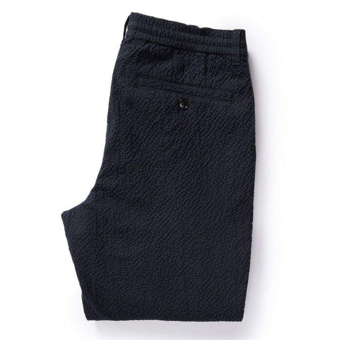 flatlay of The Easy Pant in Heather Navy Seersucker, shown folded from back
