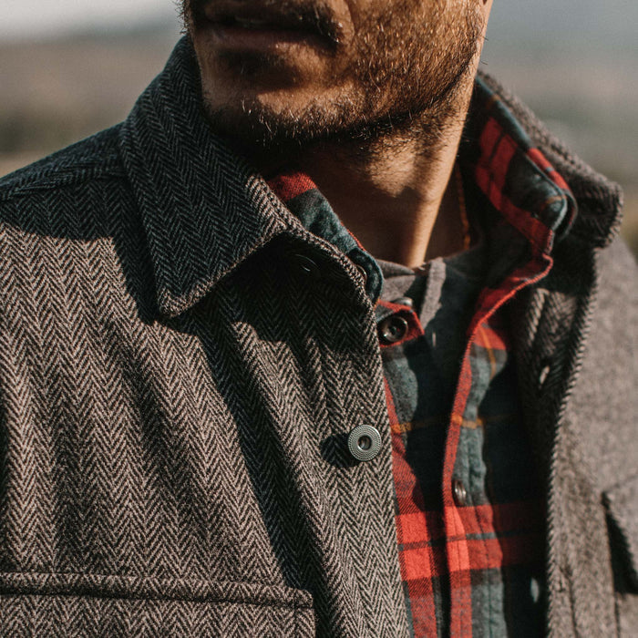 fit model wearing The Explorer Shirt in Coal Herringbone Wool with close up of collar
