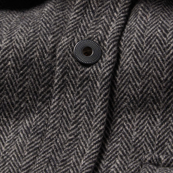 material shot of The Explorer Shirt in Coal Herringbone Wool showing front placket and button design