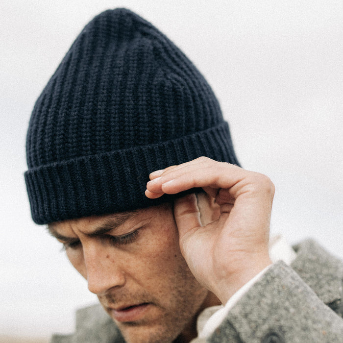 fit model adjusting The Fisherman Beanie in Dark Navy