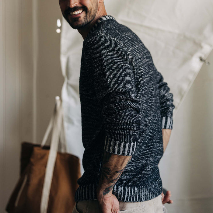 fit model showing the side of The Headland Sweater in Coal Heather