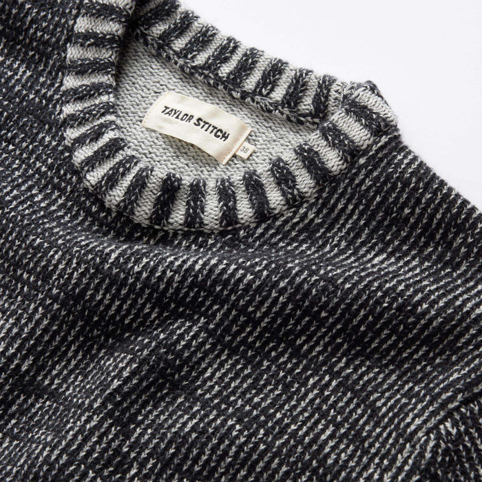 material shot of the ribbed neck opening on The Headland Sweater in Coal Heather