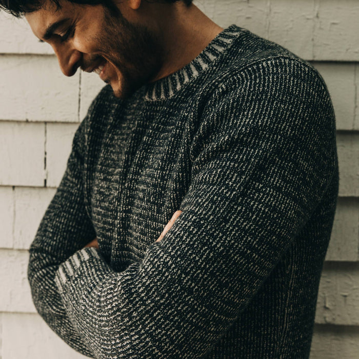 our fit model wearing The Headland Sweater in Marled Navy—cropped shot of arms crossed
