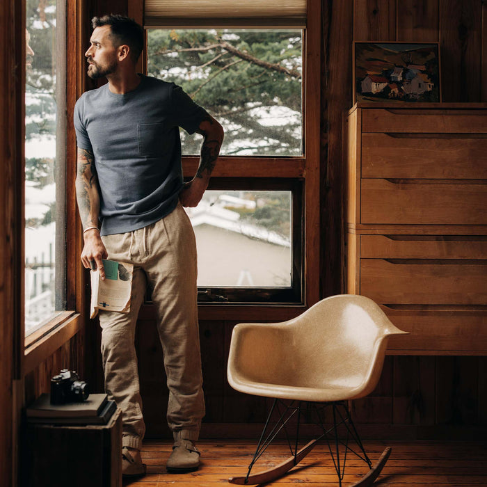 fit model wearing The Heavy Bag Tee in Storm in a cabin