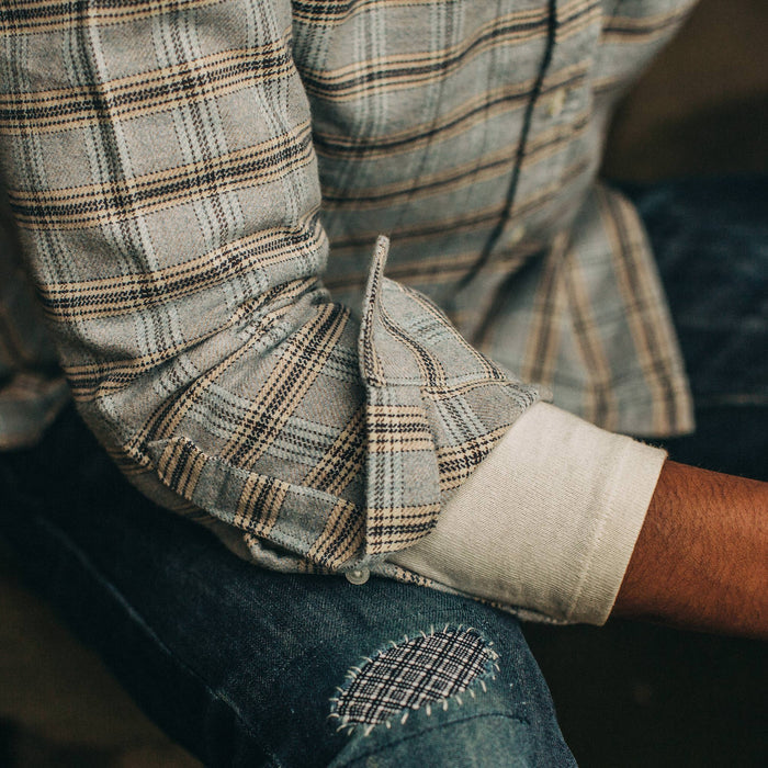 fit model wearing The Jack in Sky Plaid, cuffed over henley