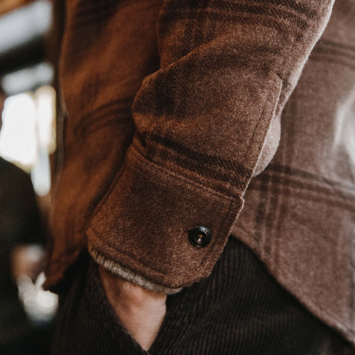 fit model wearing The Maritime Shirt in Espresso Plaid Wool showing buttoned sleeve cuff