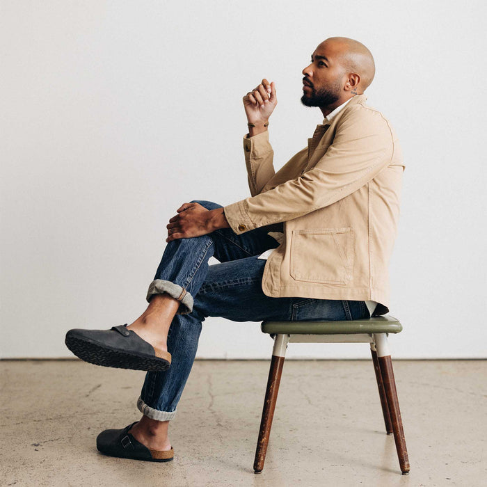 fit model sitting wearing The Ojai Jacket in Organic Light Khaki Foundation Twill