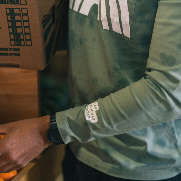 fit model packing oranges in The Organic Cotton Long Sleeve in Ecology Center