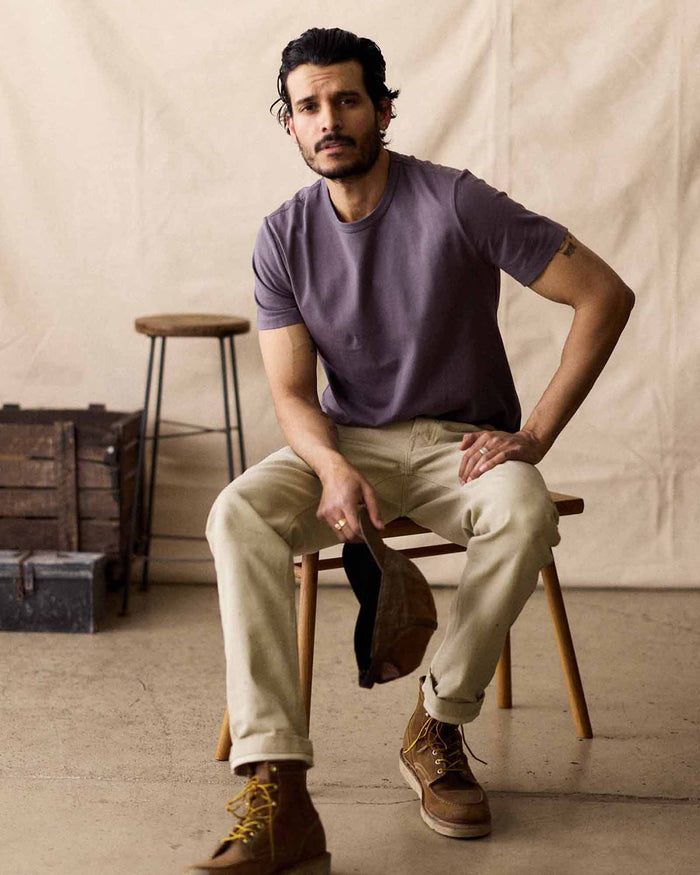 fit model sitting in The Organic Cotton Tee in Dried Plum
