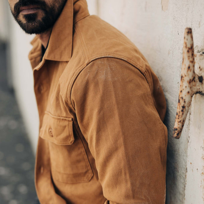 fit model showing the side of The Shop Shirt in Cedar Boss Duck