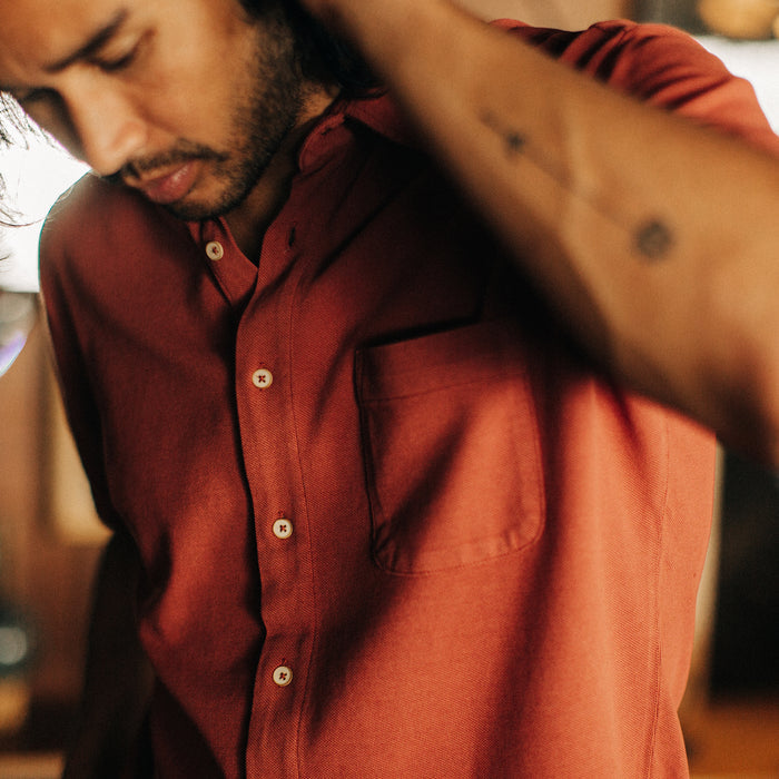 fit model posing in The Short Sleeve California in Red Clay Pique