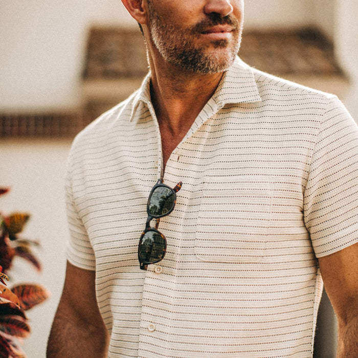 fit model wearingThe Short Sleeve Hawthorne in Natural Pickstitch Waffle, chest crop nose down
