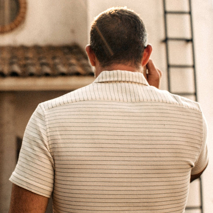 fit model wearingThe Short Sleeve Hawthorne in Natural Pickstitch Waffle, back shot