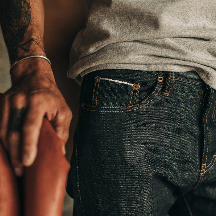 fit model wearing The Slim Jean in Nihon Menpu Selvage, up close shot of pocket