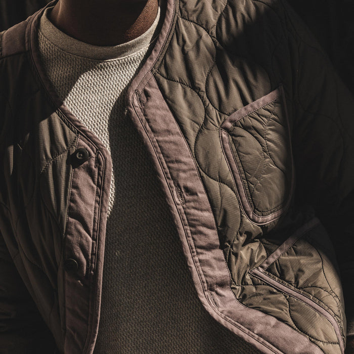 our fit model wearing The Taylor Stitch x Alpha Industries ALS/92 in Raven—cropped shot of chest