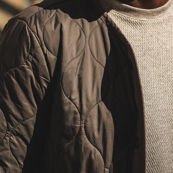 our fit model wearing The Taylor Stitch x Alpha Industries ALS/92 in Raven—cropped shot of material