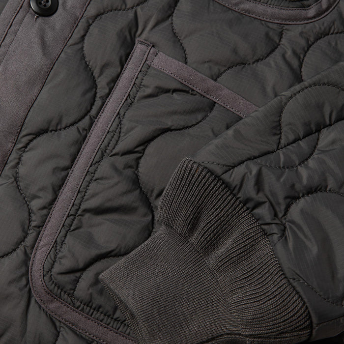 material shot of cuff and pocket detail