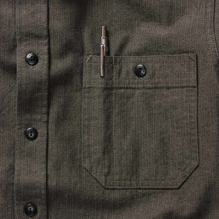 material shot of the chest pocket with pen holder on The Utility Shirt in Olive Broken Herringbone