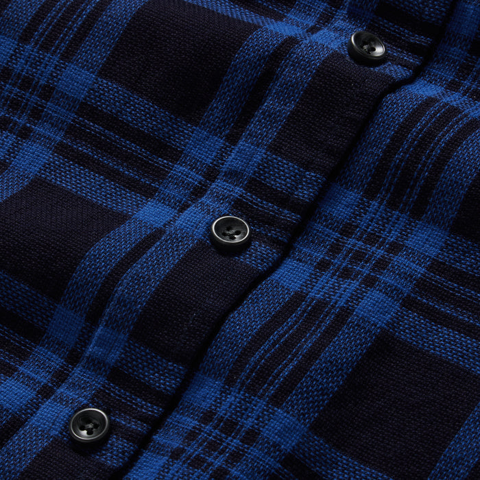 material shot of the buttons on The Utility Shirt Rinsed Indigo Plaid