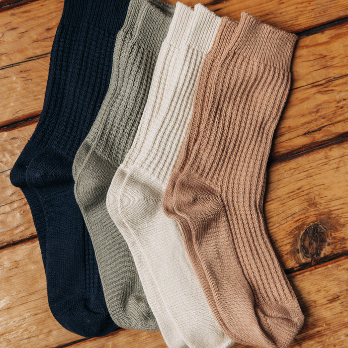 editorial image of various socks for The Waffle Sock in Natural