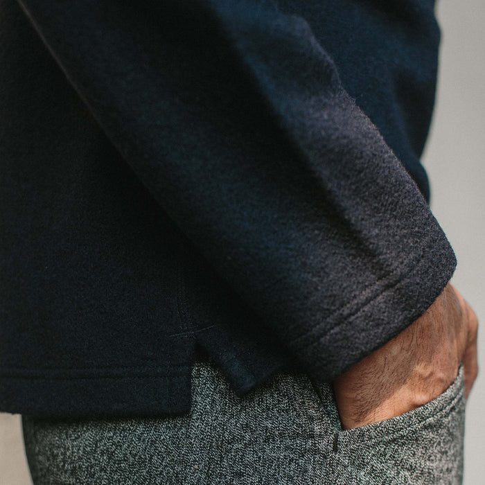 Fit model wearing The Weekend Crewneck in Navy Boiled Wool with hand in pocket