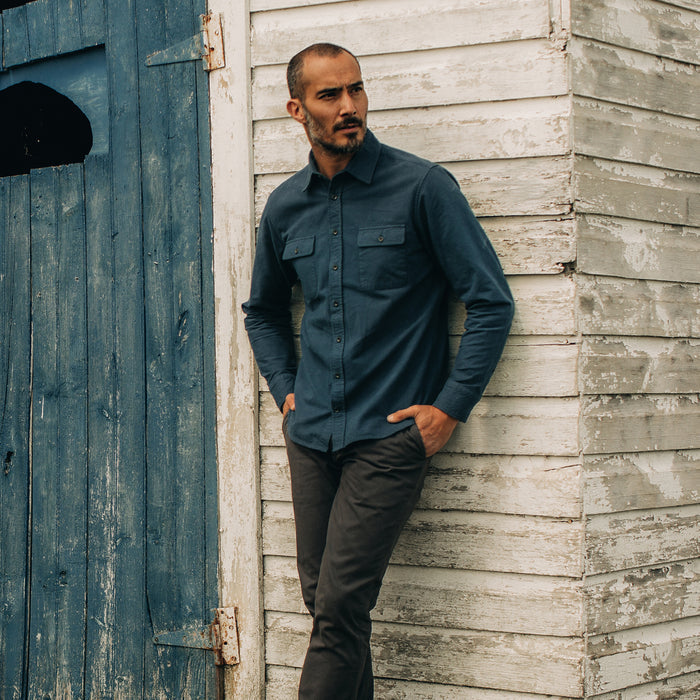 fit model leaning against the wall wearing The Yosemite in Prussian Blue