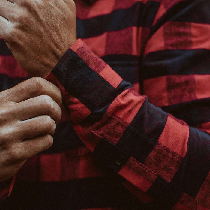 The fit model fixing his cuff of the Yosemite Shirt